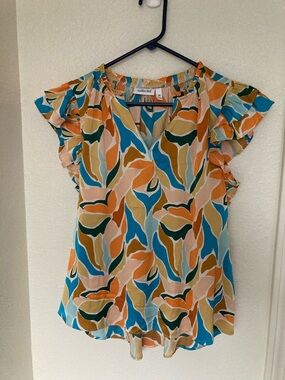 Vibrant Ruffle Sleeve Blouse